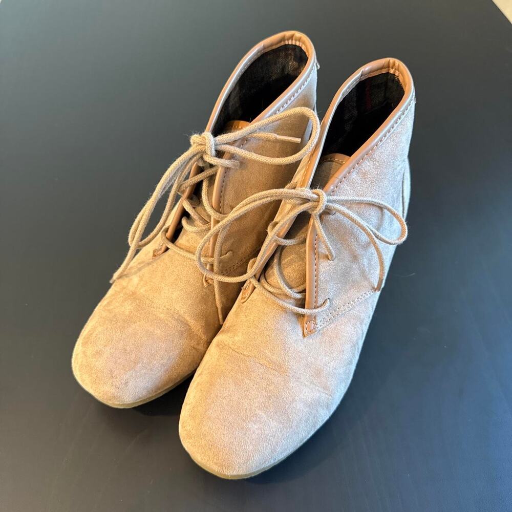 Tan suede ankle boots with lace-up design and chunky sole